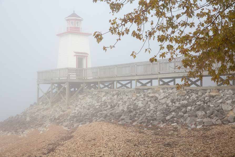 Image of a lighthouse on a foggy day.